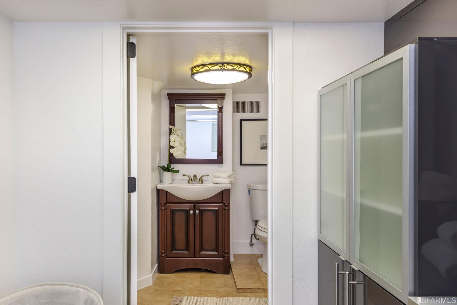 9 Bancroft Road Burlingame, CA 94010 - Photo 43 of 45 a bathroom with a sink and a mirror