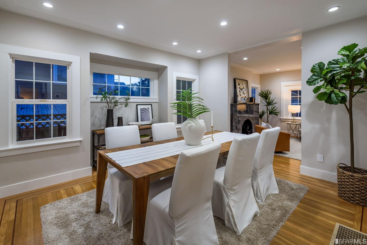 9 Bancroft Road Burlingame, CA 94010 - Photo 8 of 45 a living room with furniture a potted plant and a large window