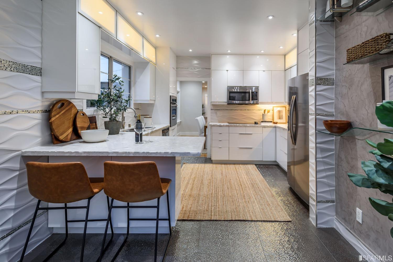 9 Bancroft Road Burlingame, CA 94010 - Photo 10 of 45 a kitchen with a table chairs sink and cabinets