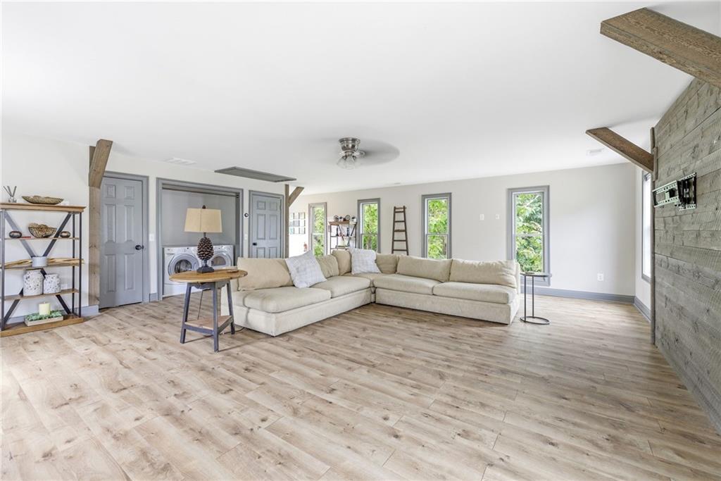 4337 Mountain View Road Oakwood, GA 30566 - Photo 55 of 84 a living room with furniture and a wooden floor