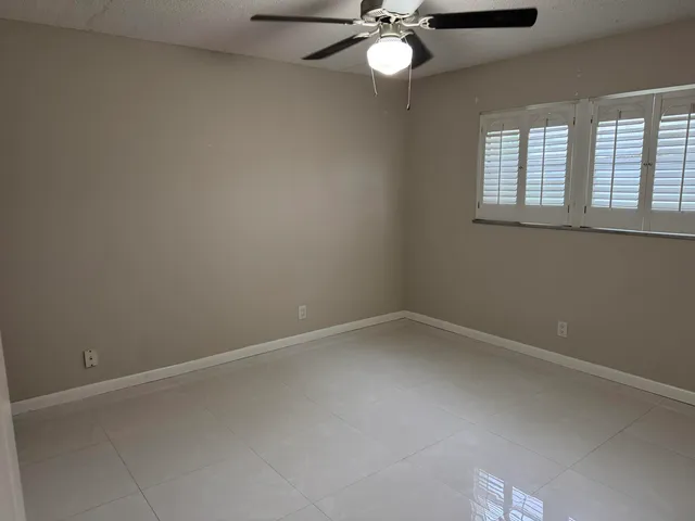 a bathroom with a sink vanity and toilet