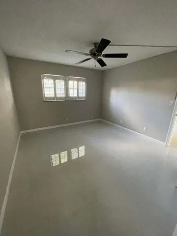 a bathroom with a toilet a sink a mirror and a bathtub