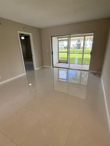 a view of a room with a large window