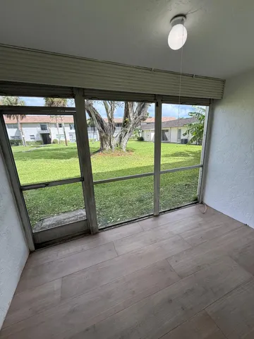 an empty room with windows and outdoor space