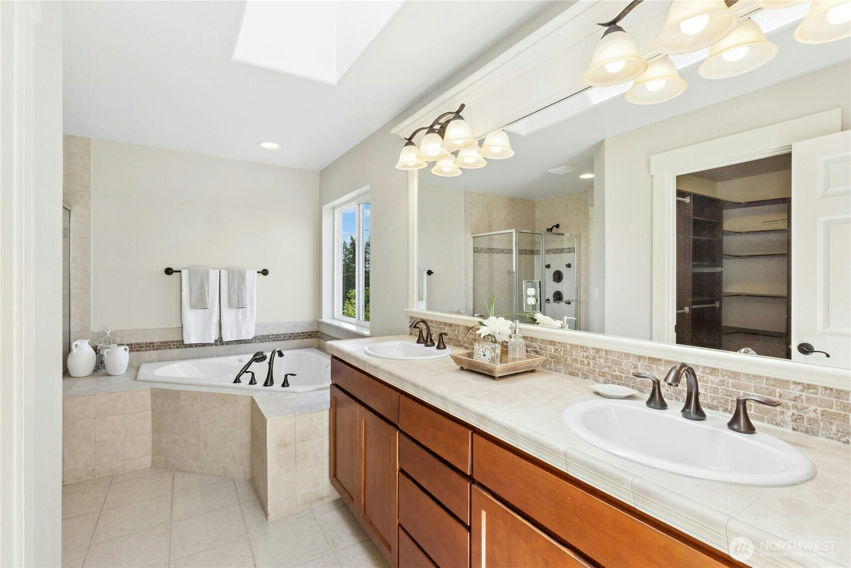 22624 43rd Drive Southeast Bothell, WA 98021 - Photo 19 of 36 a bathroom with a sink double vanity and a mirror