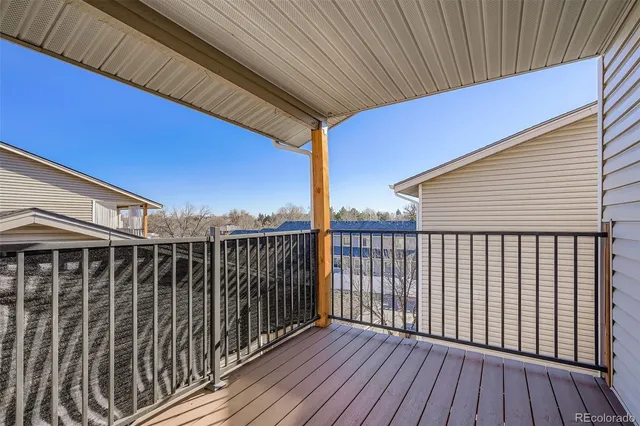 a view of deck with wooden floor and fence
