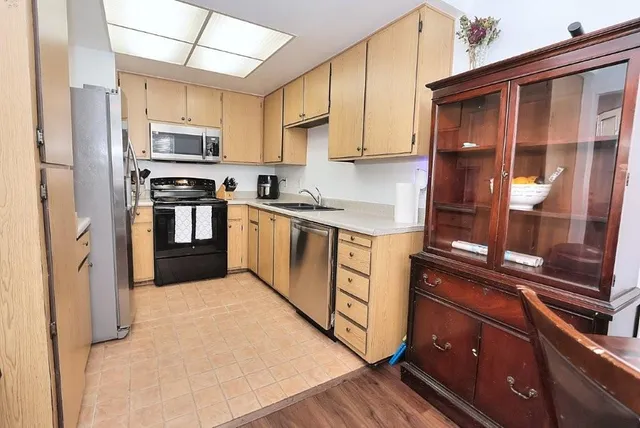 a view of a dining room with furniture and window