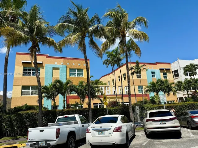 a view of multiple houses with a street