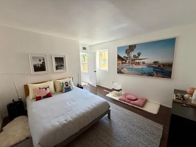 a bedroom with a bed and dresser