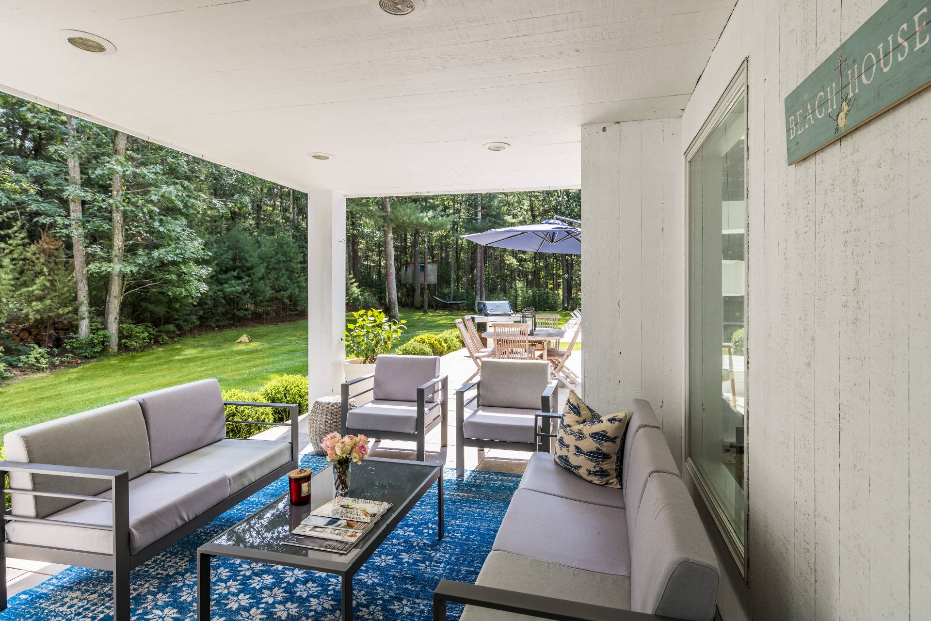 52 Bull Path East Hampton, NY 11937 - Photo 19 of 24 a outdoor living space with furniture and garden view