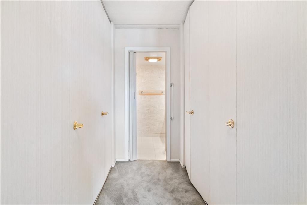 5600 Munhall Road, Unit 606 Pittsburgh, PA 15217 - Photo 17 of 30 a view of a hallway with wooden floor