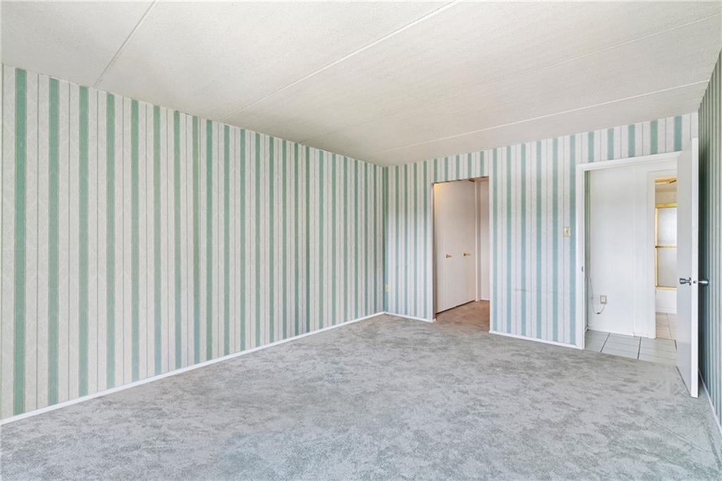 5600 Munhall Road, Unit 606 Pittsburgh, PA 15217 - Photo 19 of 30 a view of a room with a wooden door