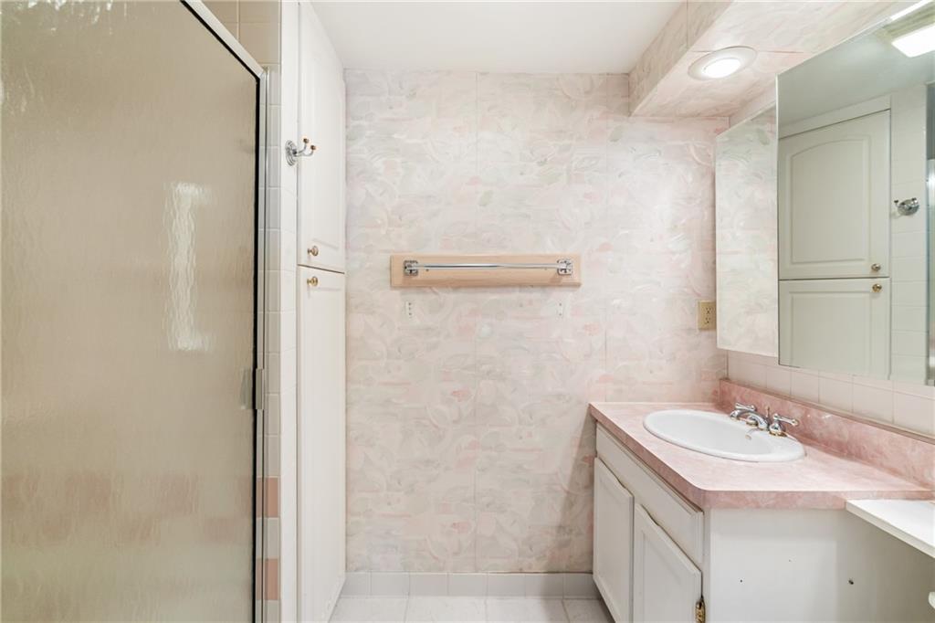 5600 Munhall Road, Unit 606 Pittsburgh, PA 15217 - Photo 21 of 30 a bathroom with a sink and a mirror