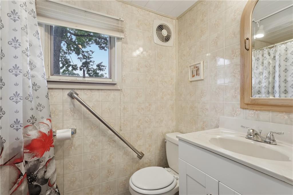 178 North Washington Road Apollo, PA 15613 - Photo 11 of 29 a bathroom with a granite countertop sink a toilet and a shower