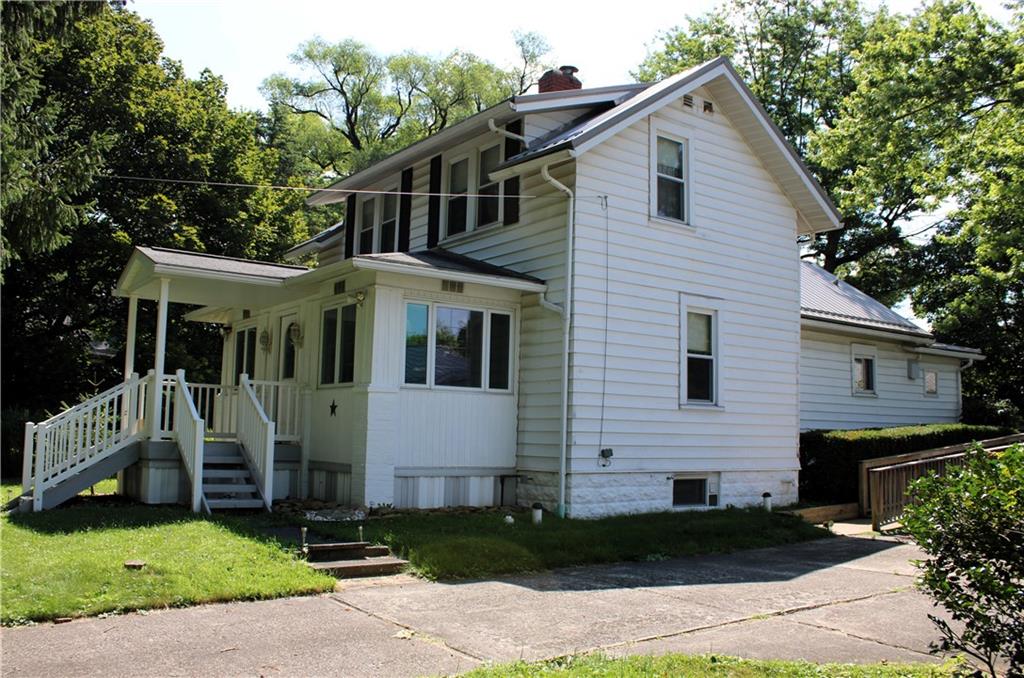 178 North Washington Road Apollo, PA 15613 - Photo 18 of 29 a view of a white house with many windows plants and large tree