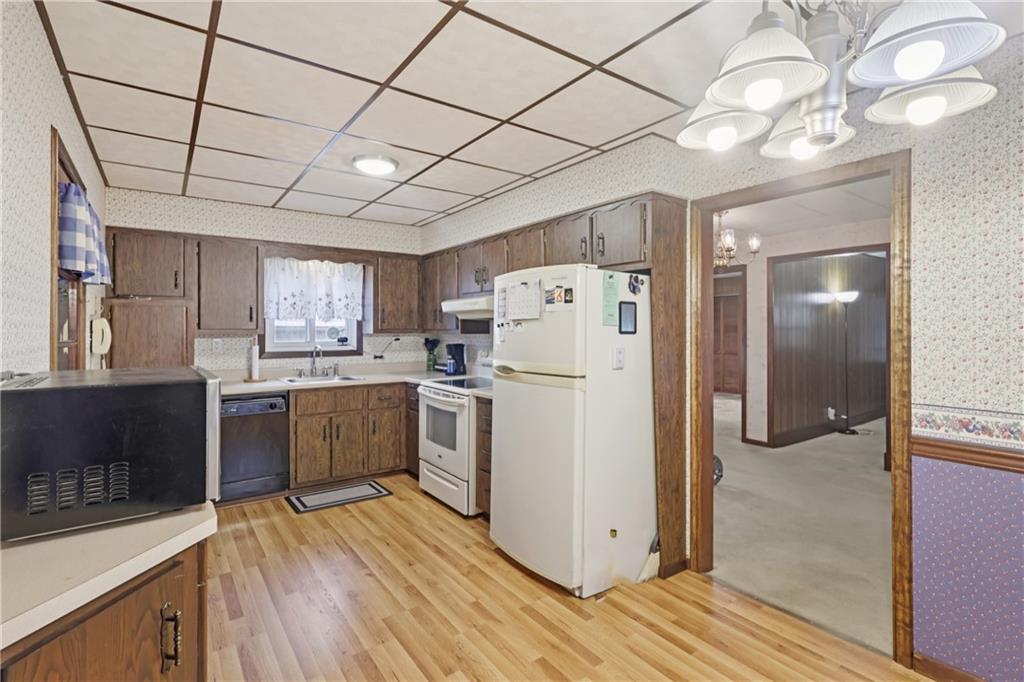 178 North Washington Road Apollo, PA 15613 - Photo 8 of 29 a kitchen with refrigerator cabinets and wooden floor