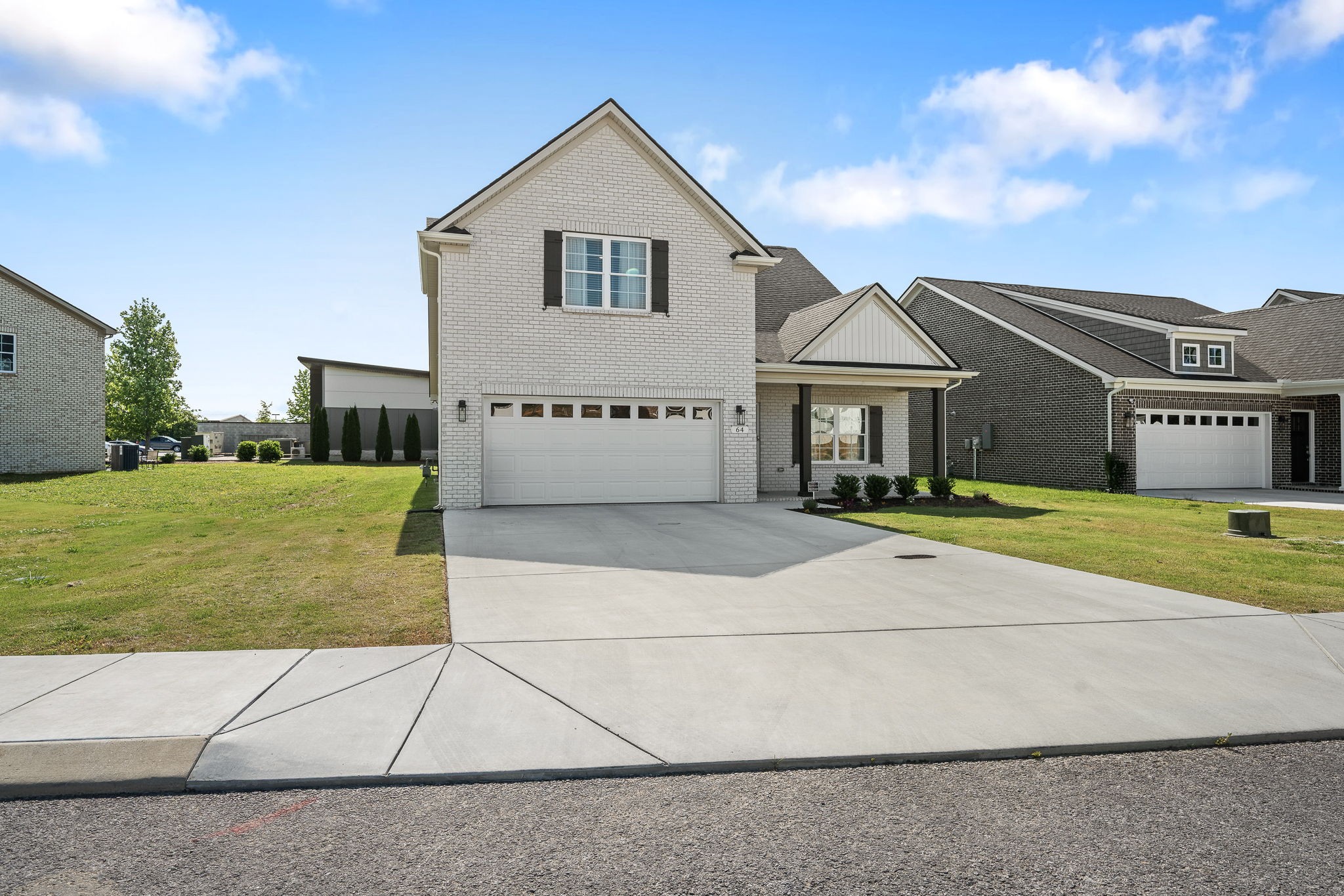 64 North Fork Branch Road Tullahoma, TN 37388 - Photo 10 of 49 a front view of a house with a yard and garage