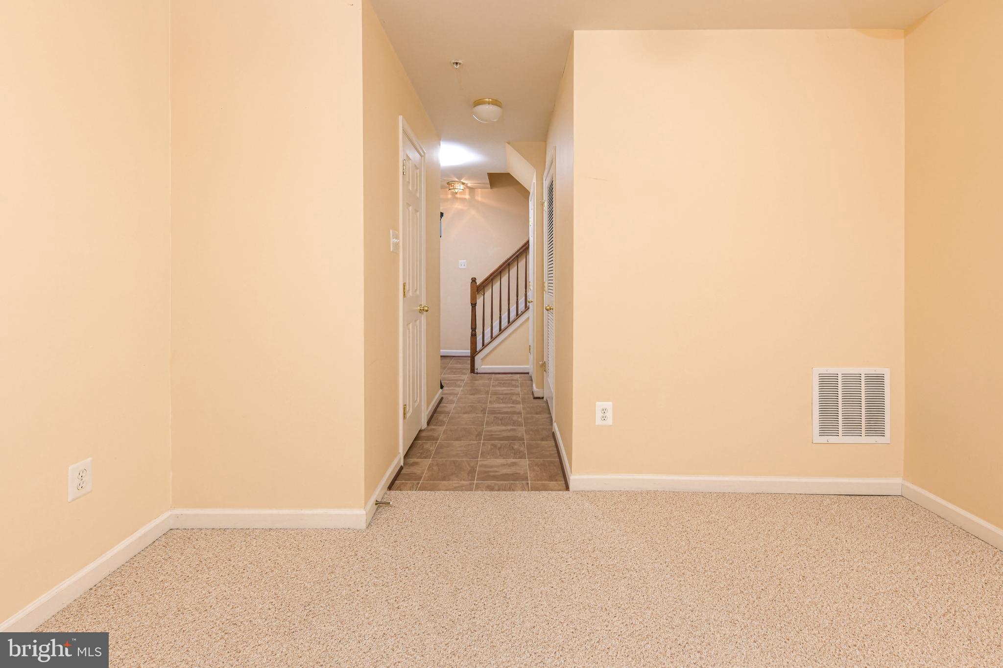 7024 Black Oak Road, Unit 216 Elkridge, MD 21075 - Photo 5 of 30 Lower level family room towards main level steps