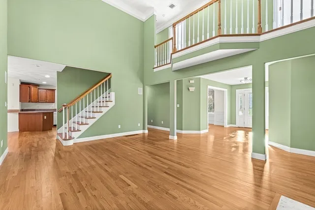 a view of an entryway with wooden floor