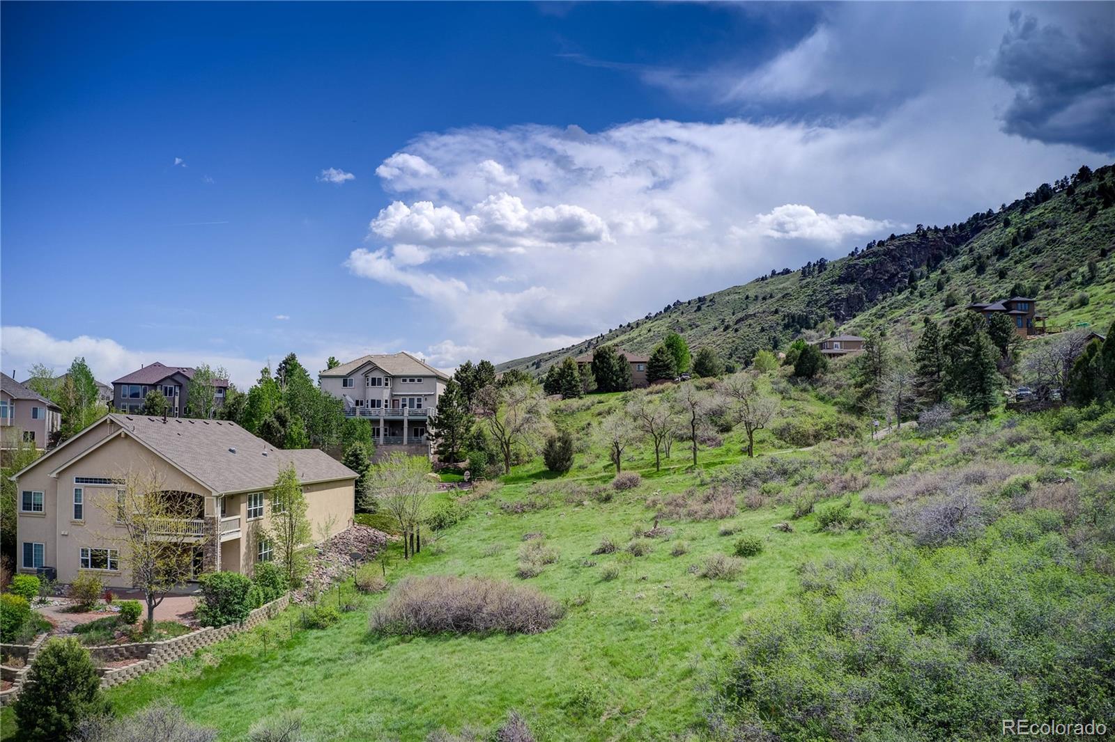 855 Shelton Road Golden, CO 80401 - Photo 12 of 27 a view of a house with a yard and potted plants