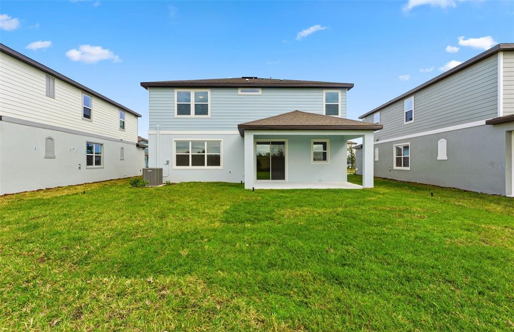 1277 Lakeridge Way Lake Lake Alfred, FL 33850 - Photo 18 of 29 a front view of a house with a garden