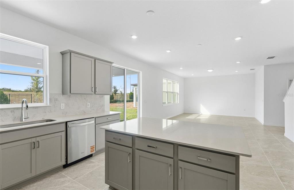 1277 Lakeridge Way Lake Lake Alfred, FL 33850 - Photo 3 of 29 a kitchen with a sink and cabinets
