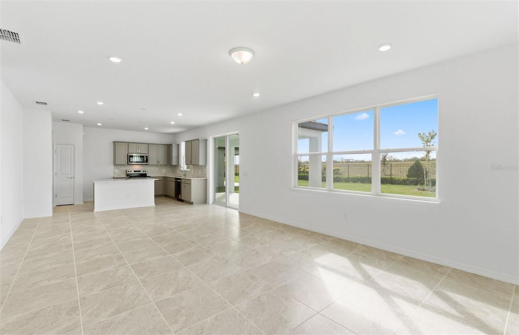 1277 Lakeridge Way Lake Lake Alfred, FL 33850 - Photo 5 of 29 a view of kitchen with furniture and window
