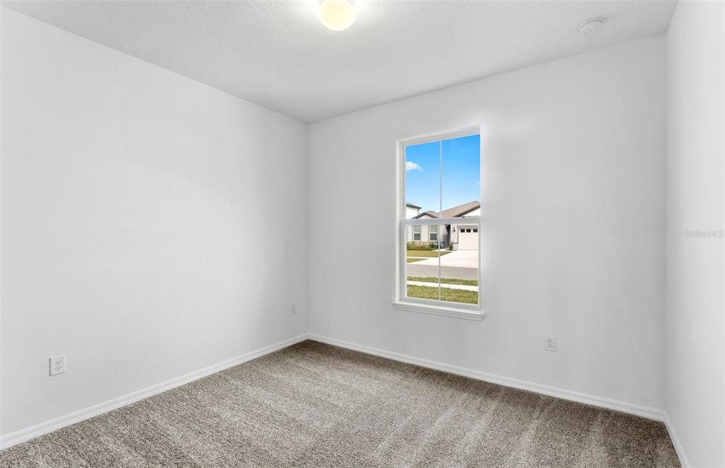 1277 Lakeridge Way Lake Lake Alfred, FL 33850 - Photo 6 of 29 an empty room with windows