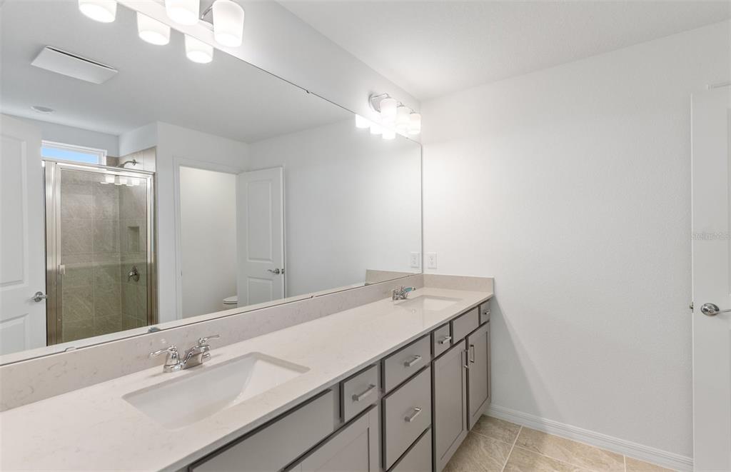 1277 Lakeridge Way Lake Lake Alfred, FL 33850 - Photo 10 of 29 a bathroom with a sink vanity granite and a mirror