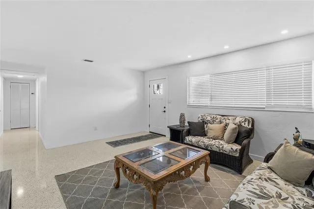 a living room with furniture and a rug