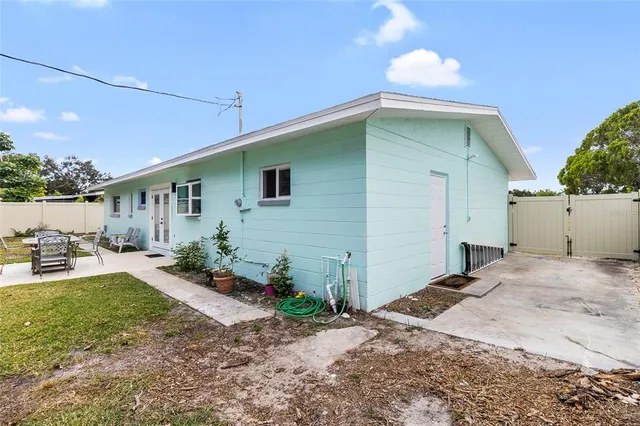 a front view of house with yard outdoor seating and barbeque oven