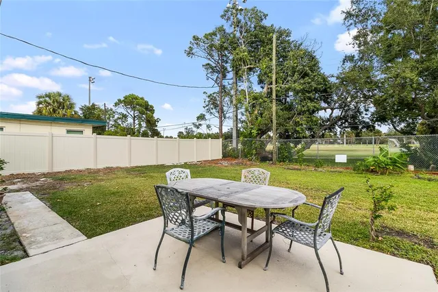 a table and chairs in a garden