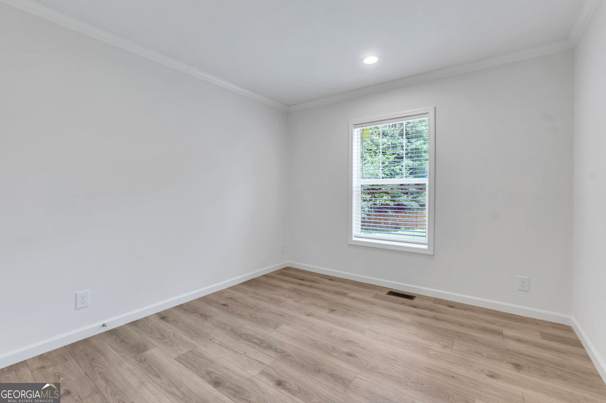 108 Old River Road Iva, SC 29655 - Photo 20 of 31 an empty room with wooden floor and windows