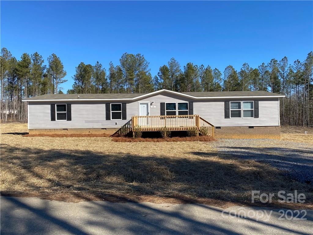 175 Mosley Road Blacksburg, SC 29702 - Photo 1 of 23 a view of a house with backyard and trees