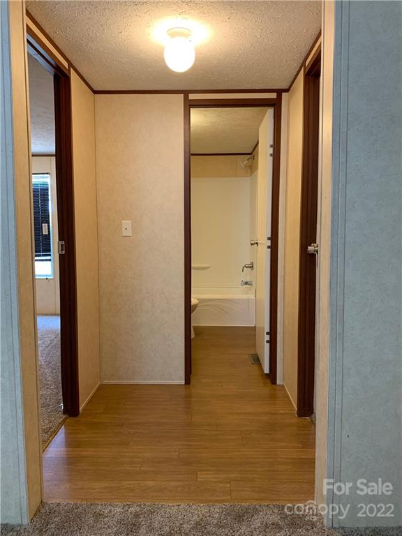 175 Mosley Road Blacksburg, SC 29702 - Photo 19 of 23 a view of a hallway with wooden floor