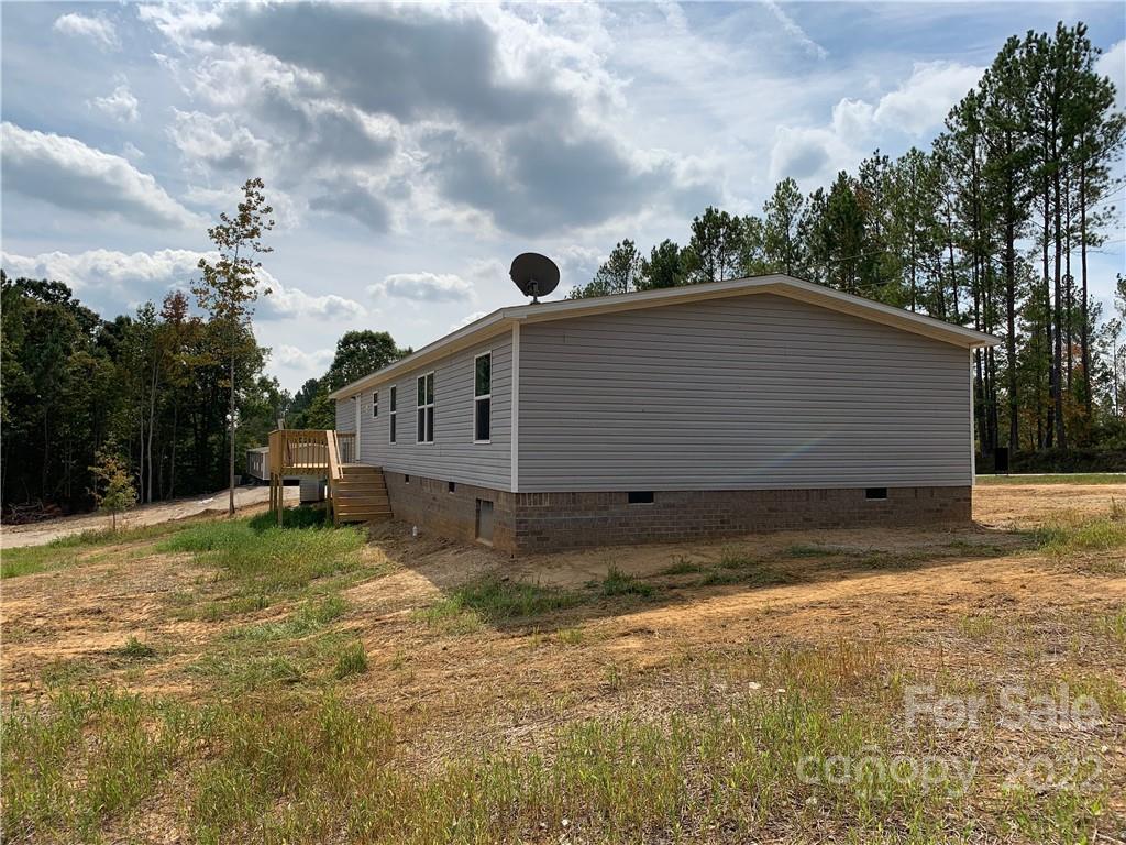 175 Mosley Road Blacksburg, SC 29702 - Photo 3 of 23 a backyard of a house with table and chairs