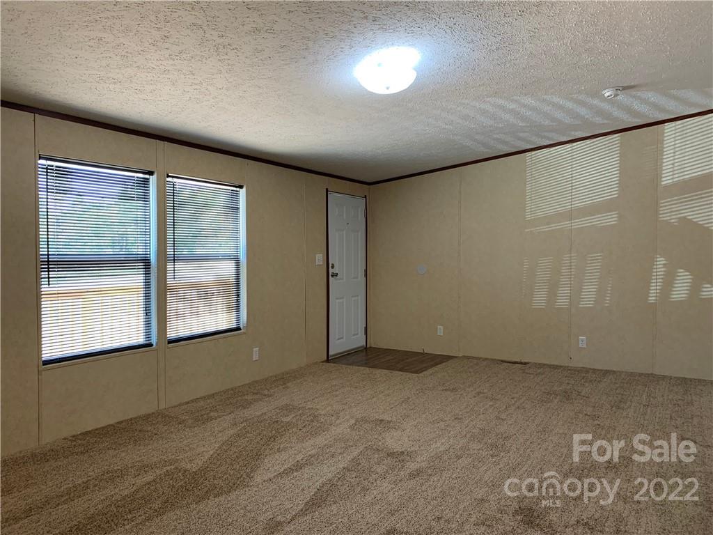 175 Mosley Road Blacksburg, SC 29702 - Photo 5 of 23 an empty room with a empty space and windows