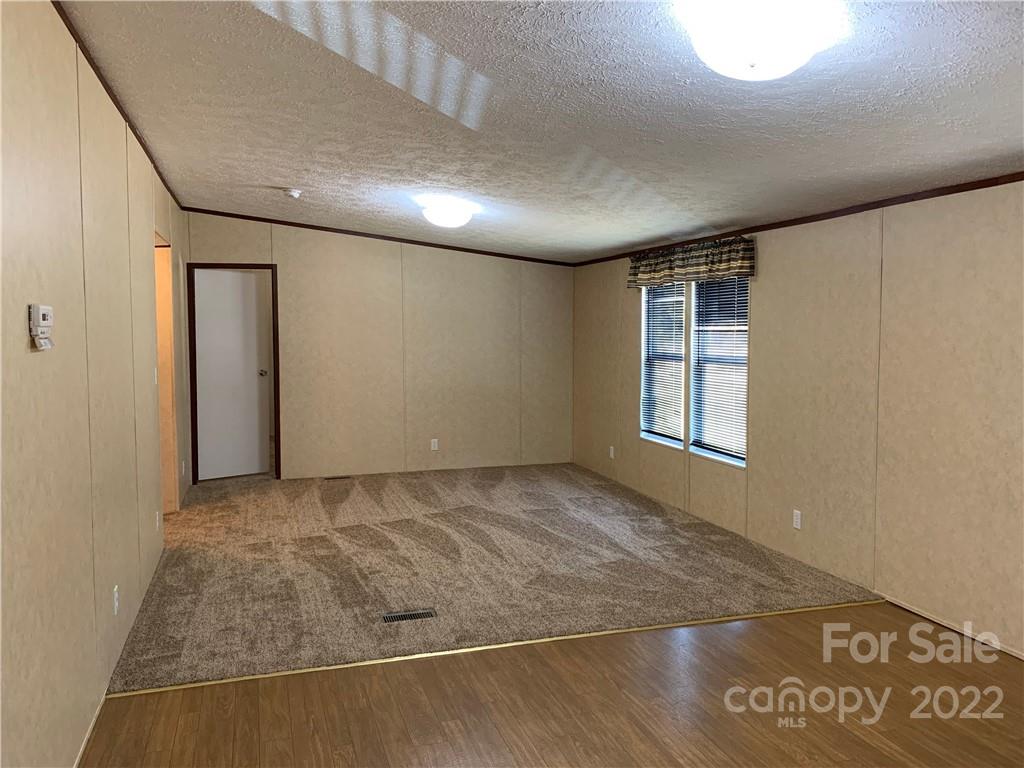 175 Mosley Road Blacksburg, SC 29702 - Photo 6 of 23 an empty room with windows