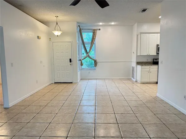 a view of an empty room and window