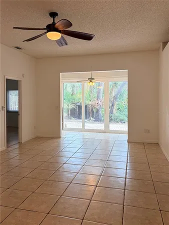 a view of an empty room with glass door