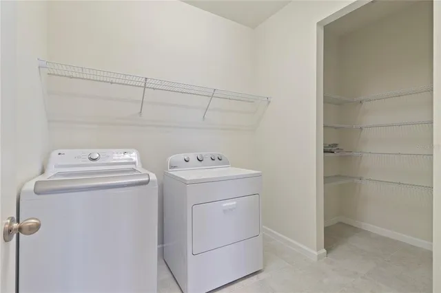 a view of a dining room with furniture and window