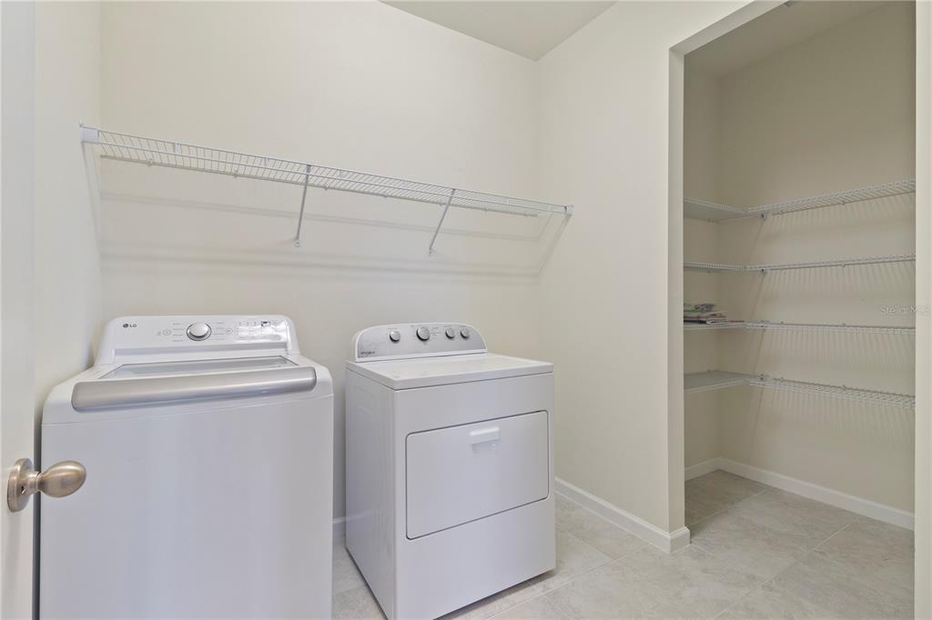 1530 Hyssop Loop North Port, FL 34289 - Photo 34 of 53 a utility room with dryer and washer