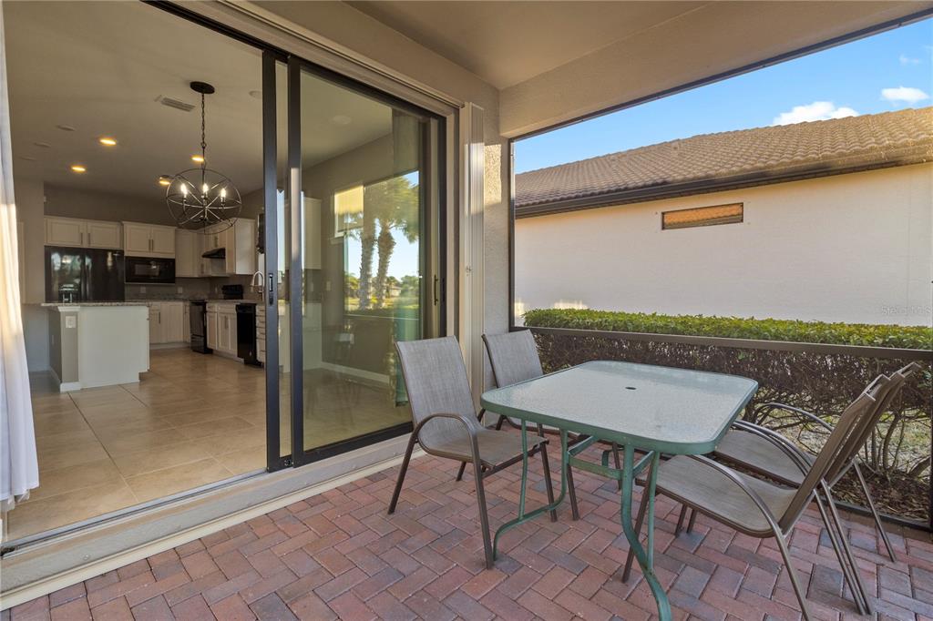 1530 Hyssop Loop North Port, FL 34289 - Photo 36 of 53 a view of a dining room with furniture window and wooden floor