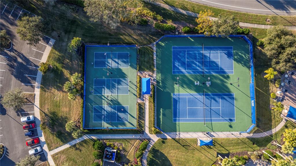 1530 Hyssop Loop North Port, FL 34289 - Photo 50 of 53 a view of brick house with a small yard and large tree