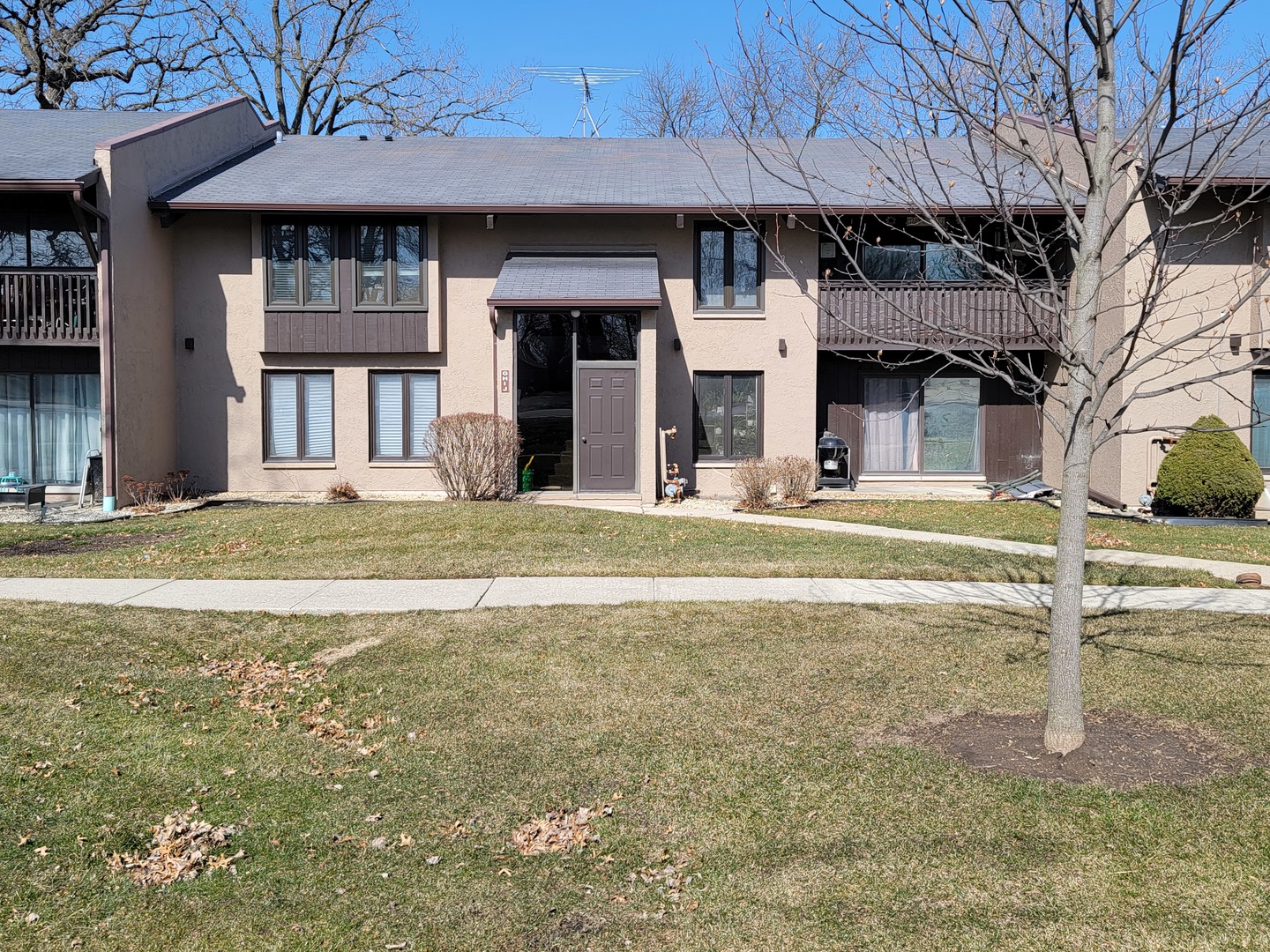 a front view of building with yard