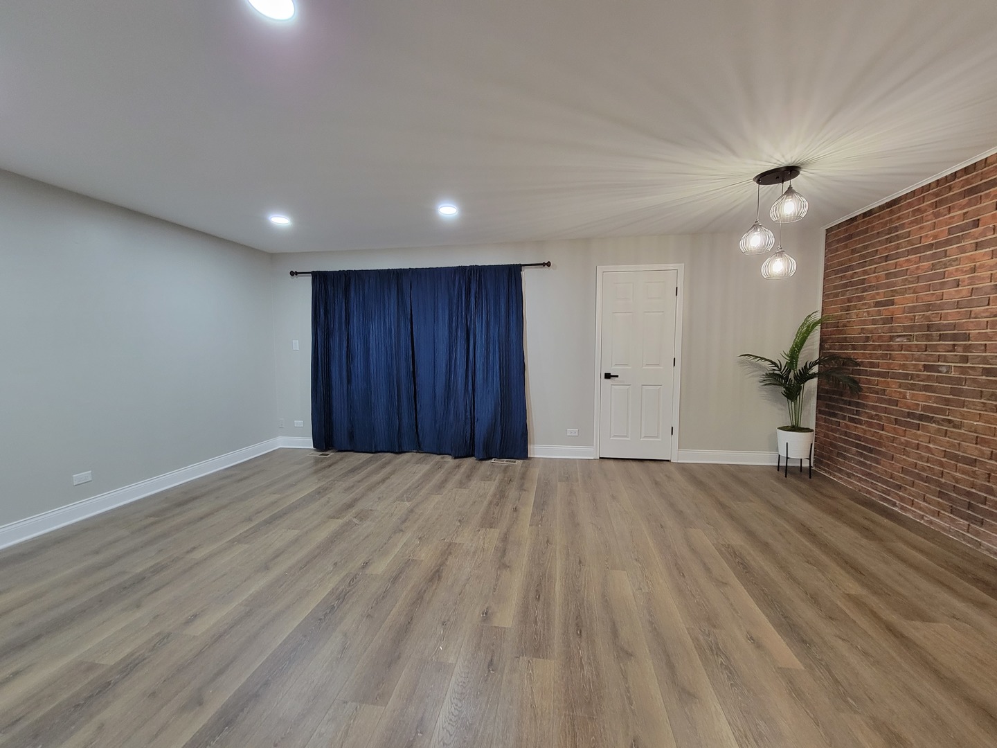 1100 Holbrook Road, Unit H Homewood, IL 60430 - Photo 11 of 14 an empty room with wooden floor and windows