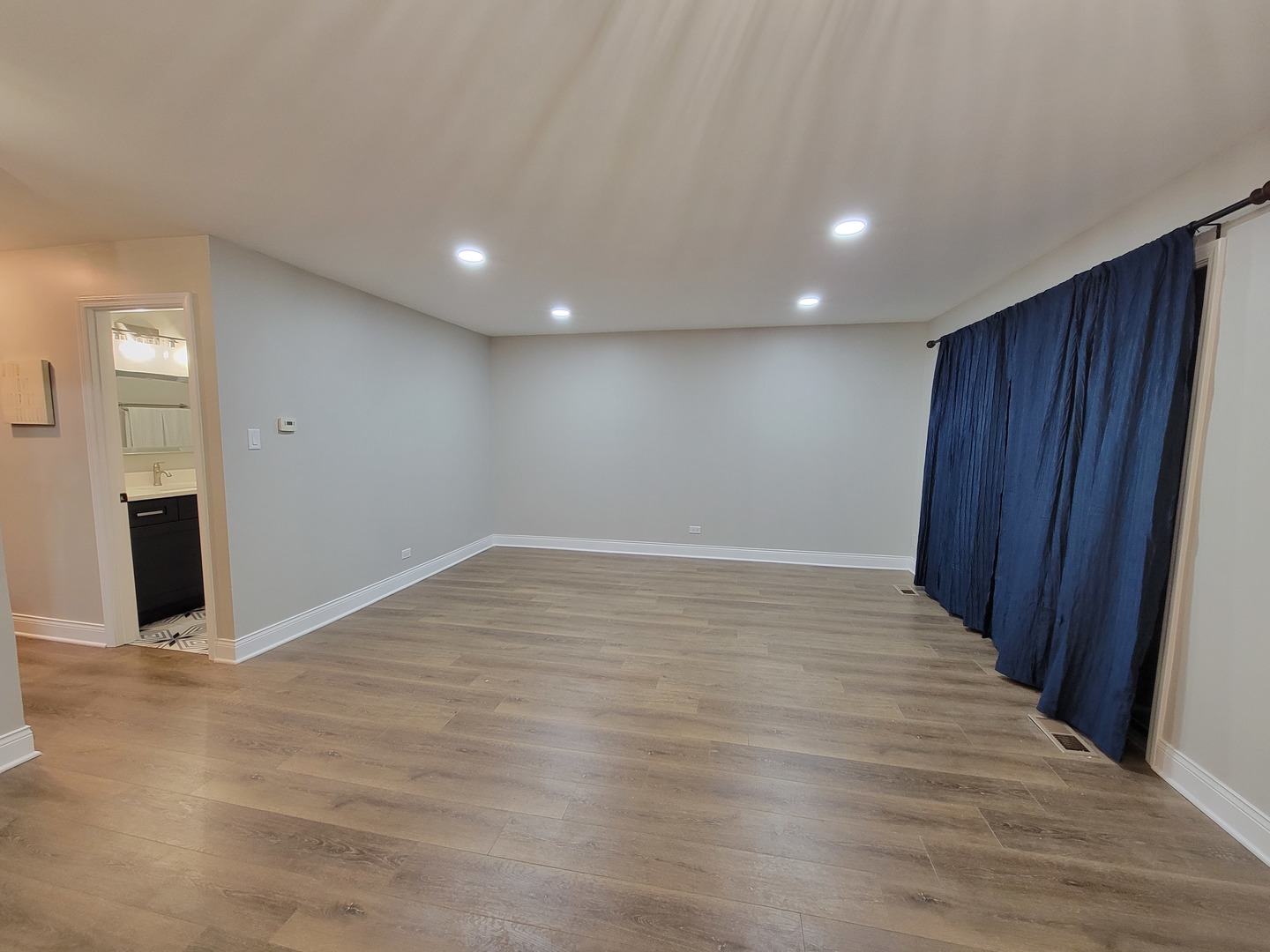1100 Holbrook Road, Unit H Homewood, IL 60430 - Photo 13 of 14 a view of an empty room with wooden floor and a window
