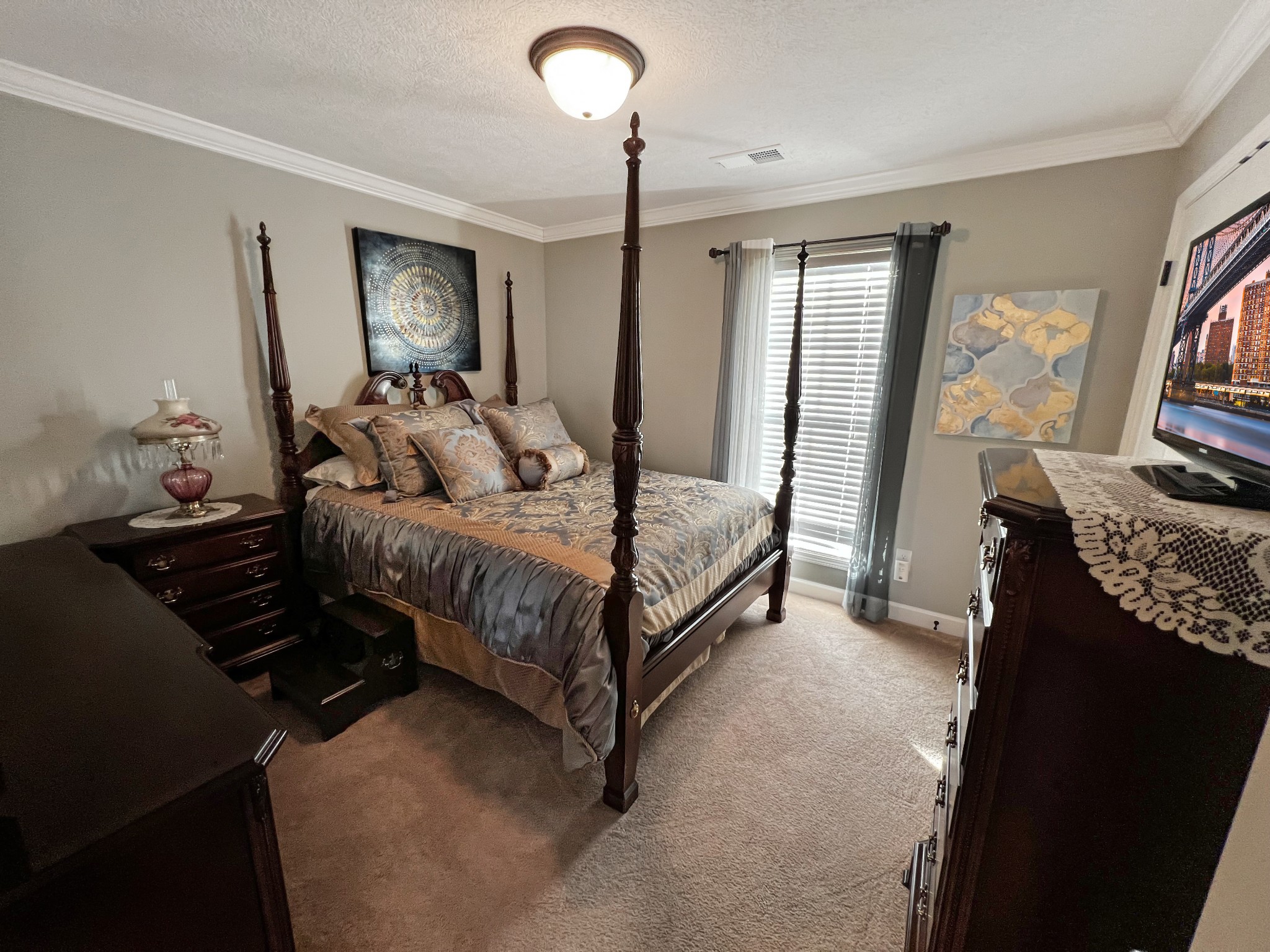48 Nehemiah Drive Jackson, TN 38305 - Photo 19 of 21 a bedroom with a bed window and a flat screen television