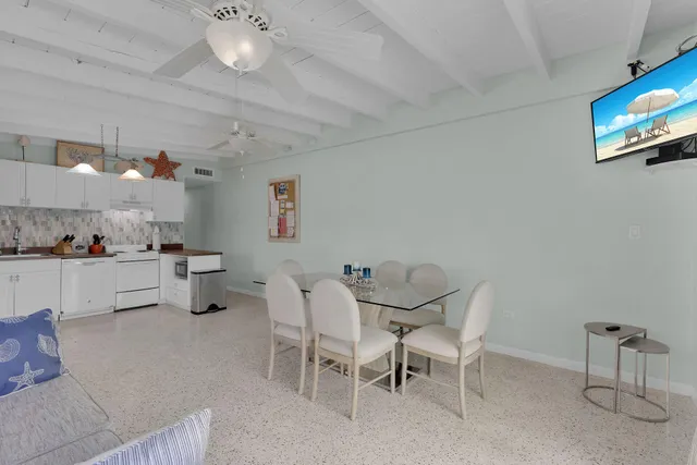 a kitchen with stainless steel appliances a refrigerator sink and cabinets