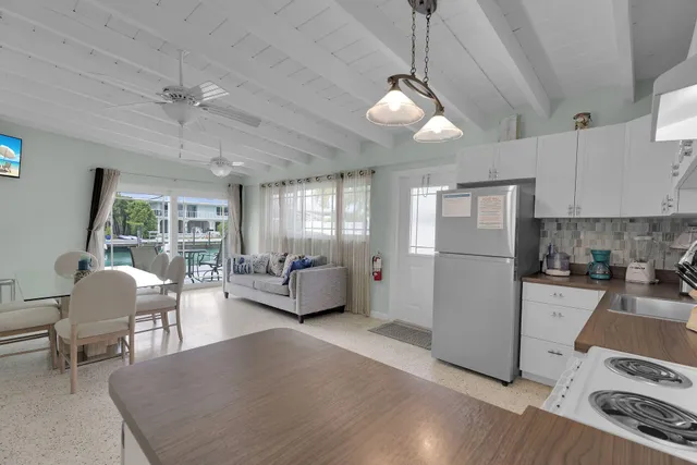 a bathroom with a sink toilet vanity and shower